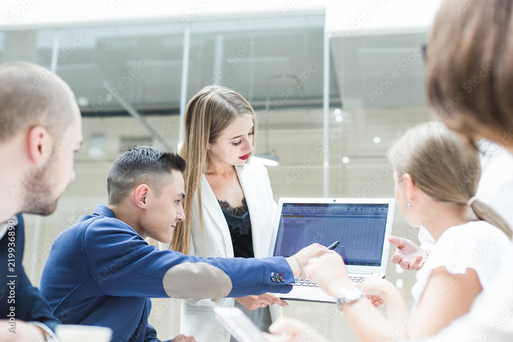 Obraz premium Group of business meeting at the table in the modern office ,Team work and diverse hands together joining business relationships with greetings and joint business partnership.