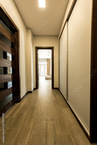 interior of empty modern corridor with wooden floor © LIGHTFIELD STUDIOS