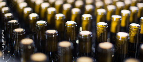 wine bottles with stoppers on modern winery