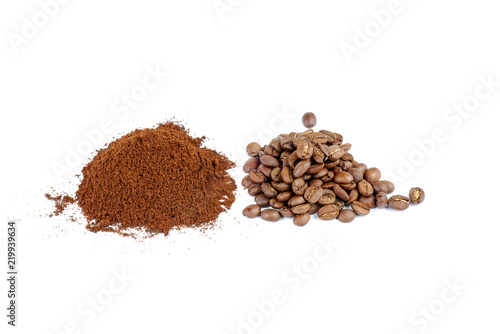 Pile of the ground coffee and beans isolated on white background