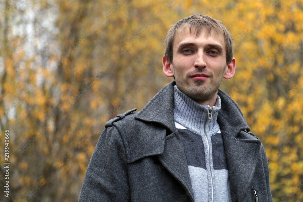 Autumn portrait of a young man on the street. Autumn portrait of a young man on the street.