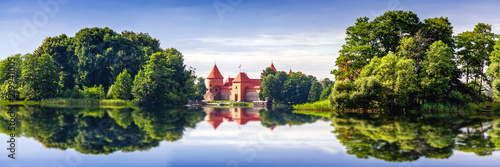 Trakai Castle Island castle in Trakai isd one of the most popular touristic destinations in Lithuania, houses a museum and a cultural center, banner panorama format photo