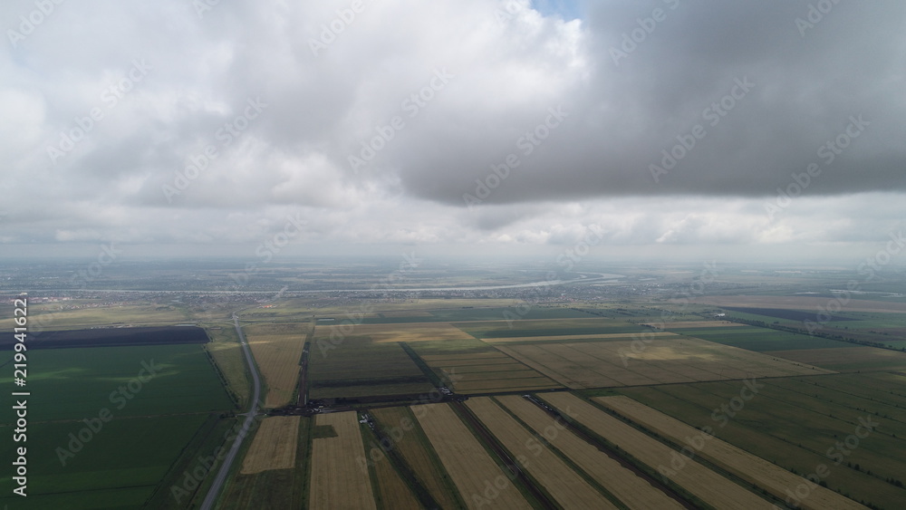 A stunning aerial view of the clouds and field