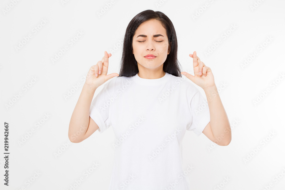 Young asian woman cross fingers for wishing good luck isolated on white background.Template summer t shirt. Copy space Young asian woman cross fingers for wishing good luck isolated on white background.Template summer t shirt. Copy space