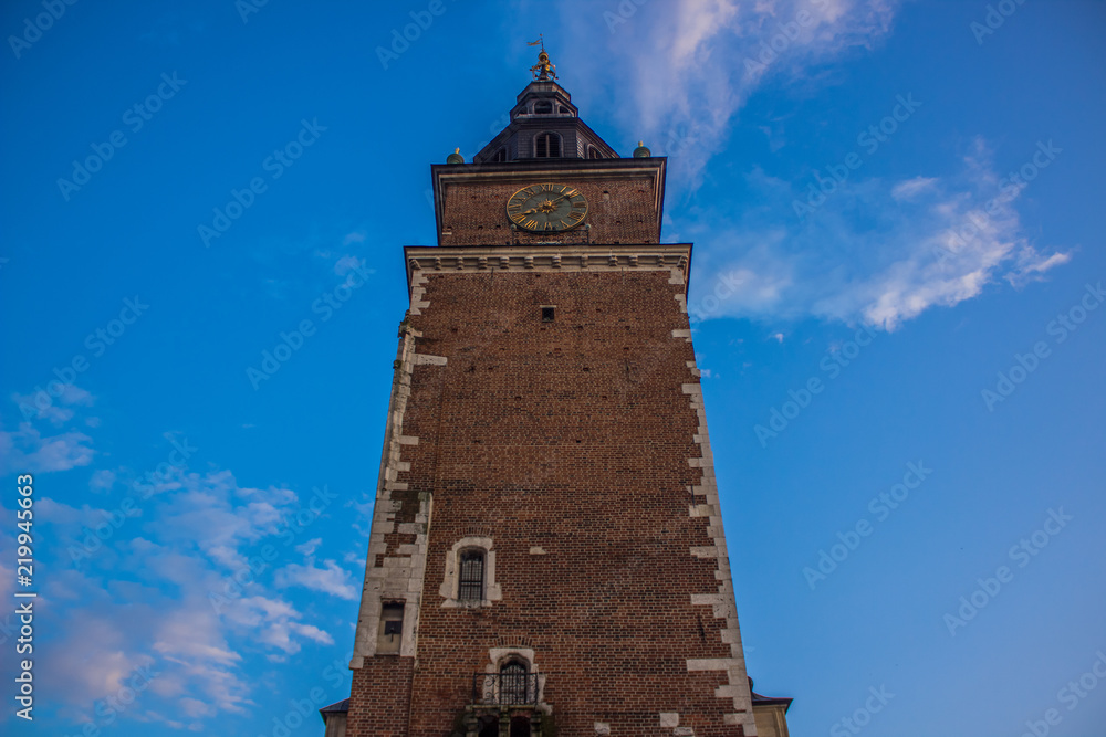 one medieval brick old tower on blue sky background