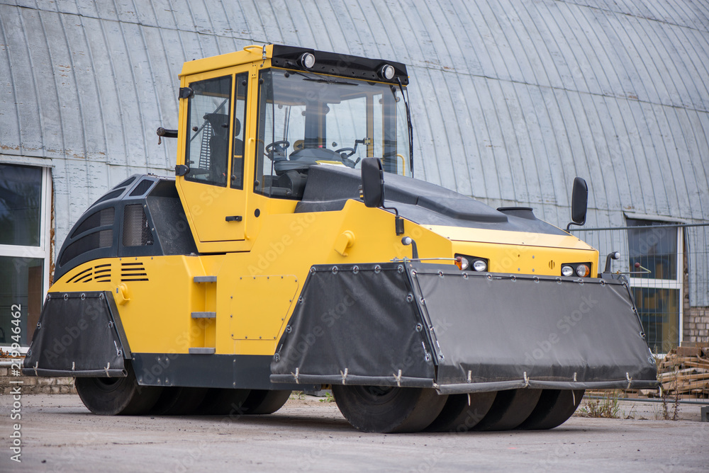 Yellow heavy vibration roller at asphalt pavement works. Road repairing in city. Freshly made asphalt
Yellow heavy vibration roller at asphalt pavement works. Road repairing in city. Freshly made asphalt