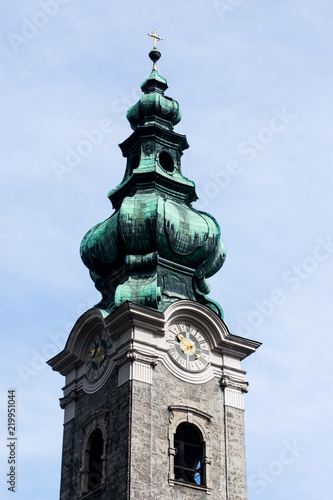 Top of a church in Salzburg, Austria, on a cloudy day but some blue sky in the background 