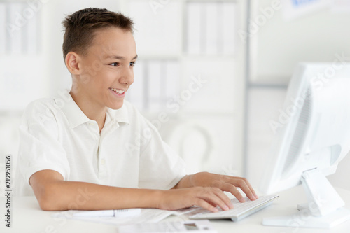 Portrait of a teenage boy with laptop © aletia2011