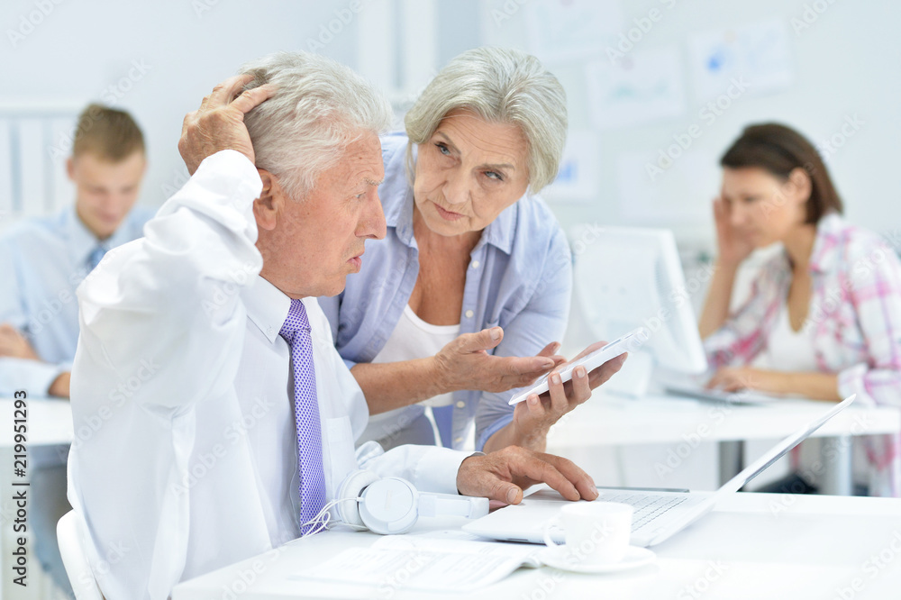 Portrait of a group of successful businesspeople working Portrait of a group of successful businesspeople working
