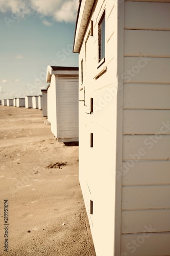 White bath houses at beach.