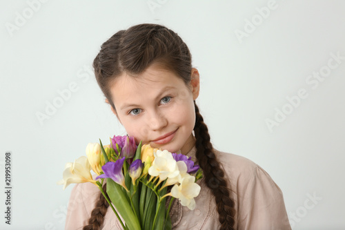 Little girl with bouquet of...