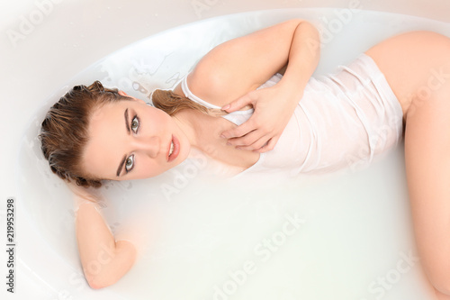 Young sexy woman relaxing in bath