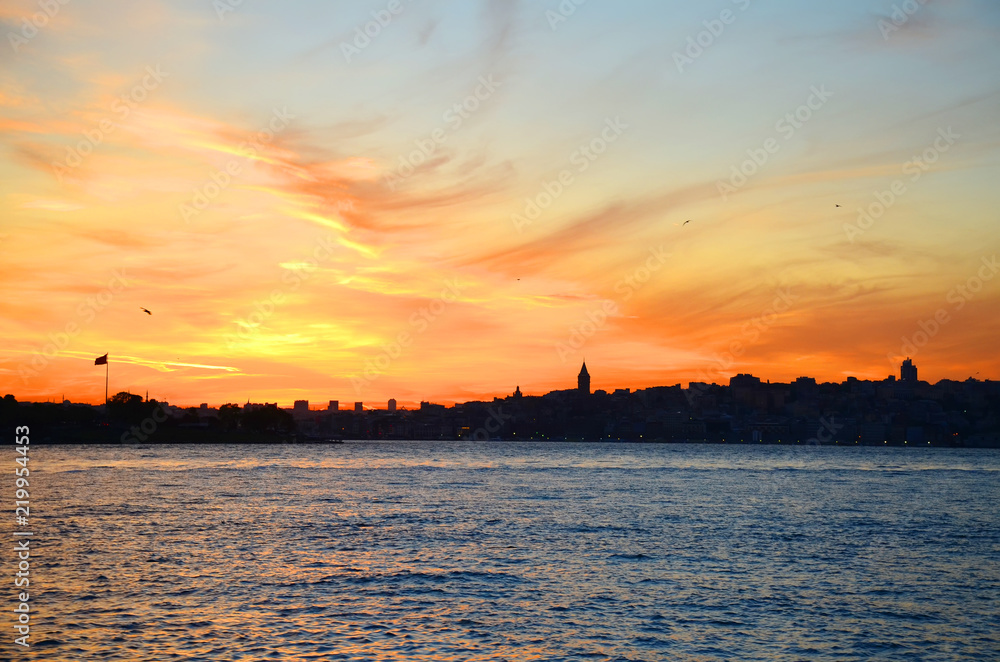 View of the historical district of Fatih from the sea of Marmara, Istanbul, Turkey. Sunset. Beautiful colorful sky.