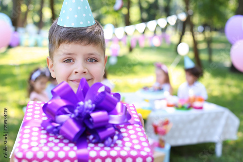 Cute little boy with gift b...
