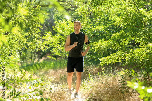 Sporty man running in park