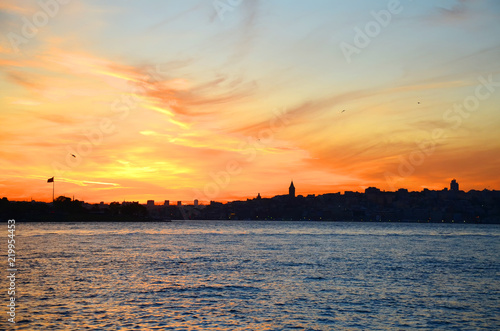 View of the historical district of Fatih from the sea of Marmara, Istanbul, Turkey. Sunset. Beautiful colorful sky.