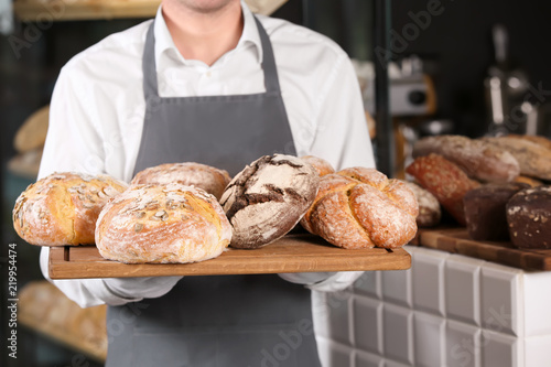 Man holding board with asso...