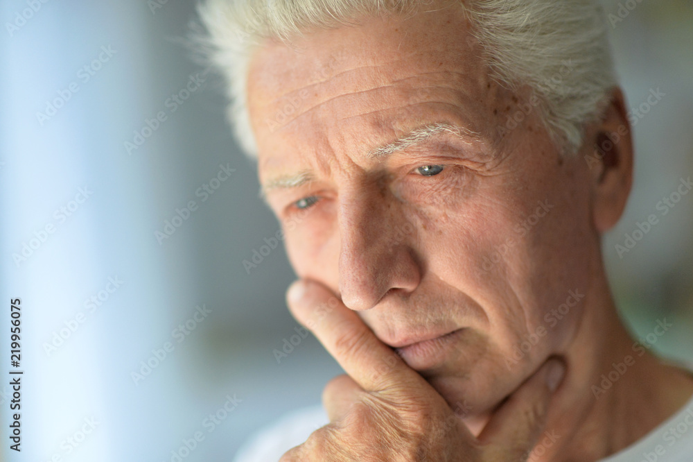 Close up portrait of a sad senior man Close up portrait of a sad senior man