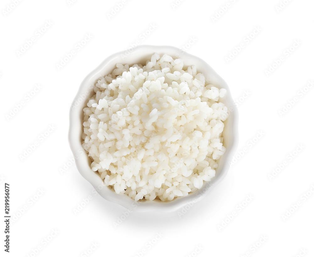 Bowl with freshly cooked rice on white background