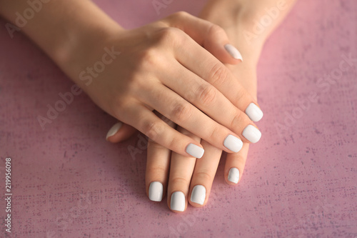 Female hands with stylish nails on color background  closeup