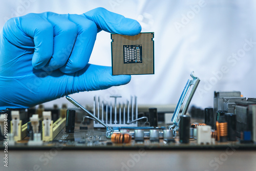 Close up portrait of computer engineer's hand is holding CPU's computer photo