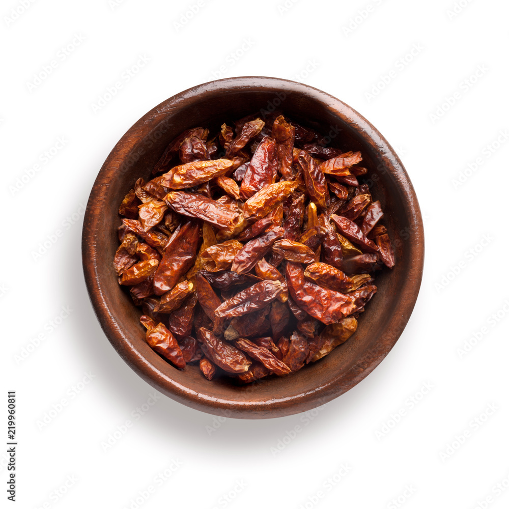 chili peppers dried in a wooden bowl, isolated on white chili peppers dried in a wooden bowl, isolated on white