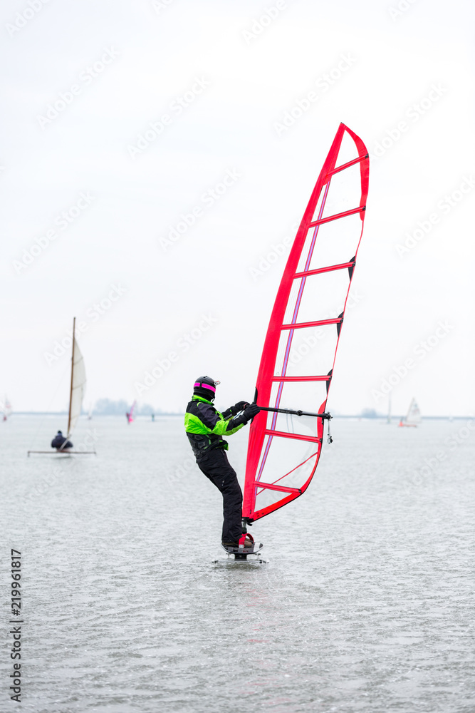 Naklejka premium Ice surfing on the Gouwzee in Monnickendam, the Netherlands.