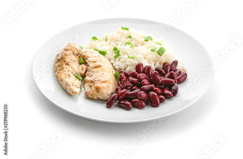 Delicious boiled rice with meat and beans on white background