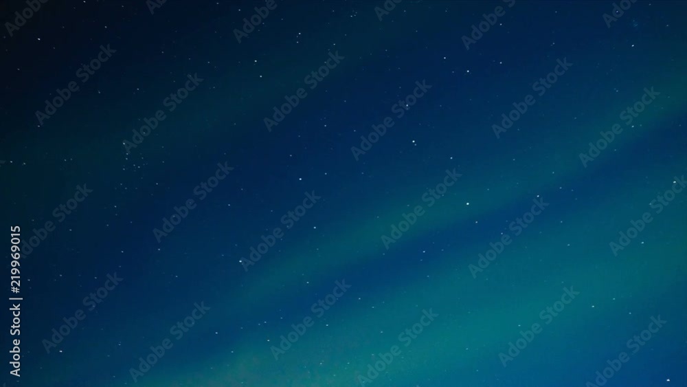 HD Time-lapse of Northern Light Aurora Borealis in the night sky over Senja island in Northern Norway. Snow covered mountains in the background where moonlight is illuminating landscape. HD Time-lapse of Northern Light Aurora Borealis in the night sky over Senja island in Northern Norway. Snow covered mountains in the background where moonlight is illuminating landscape.