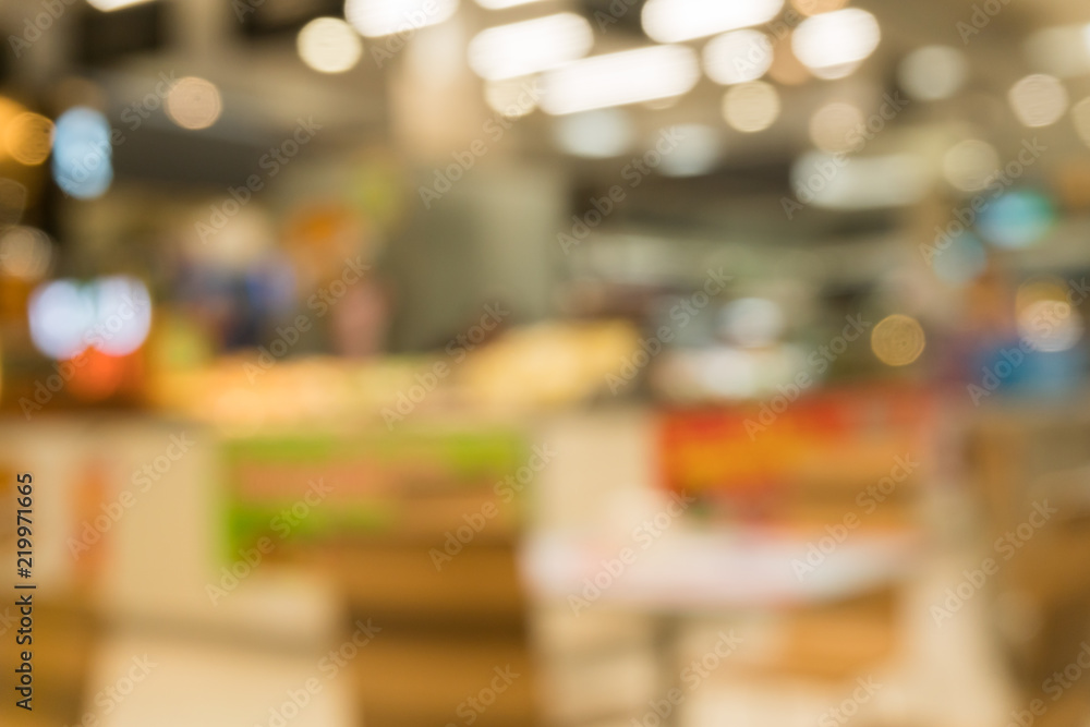 Coffee shop in department store blur background with bokeh. Blurred Interior colorful neon light in coffee shop. Coffee shop in department store blur background with bokeh. Blurred Interior colorful neon light in coffee shop.