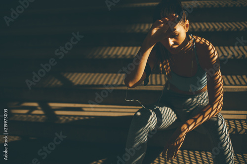 Young female runner resting...