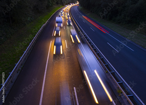 Cars on highway in traffic jam at night