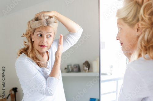 Woman checking her hair