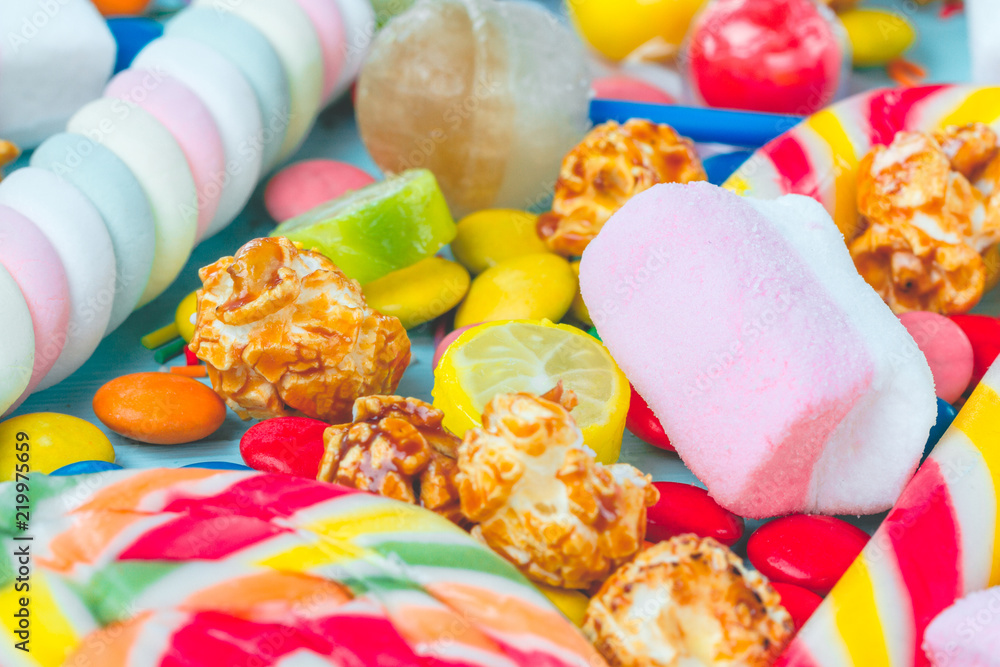 Foto de Mix of multicolored, sweets, lollipops and candies. Unhealthy, sweet, highcalorie food