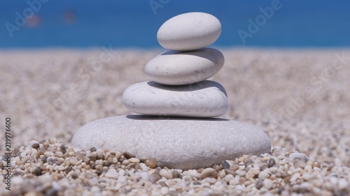 Small Tower or Pyramid Made with Small Stones on the Beach in Vacation