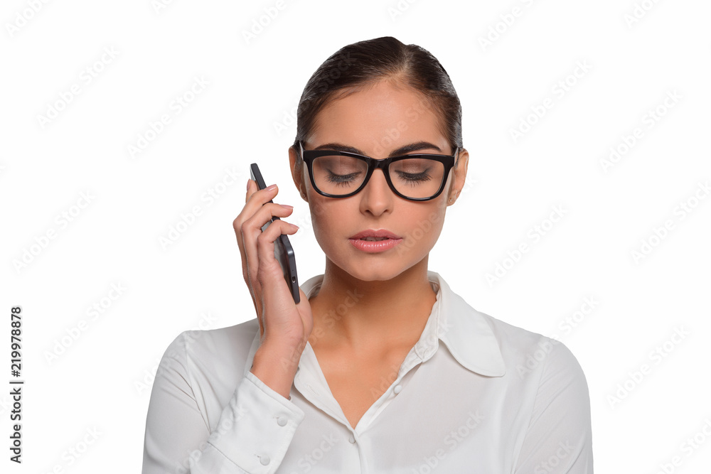Attractive businesswoman talks on the phone