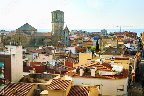 Aerial view of old spanish town Malgrat de Mar, roof tops, cityscape on the coast of Mediterranean sea, Costa Brava, Maresme, province of Barcelona, Catalonia, Spain. Travel and vacation. Horizon. photo