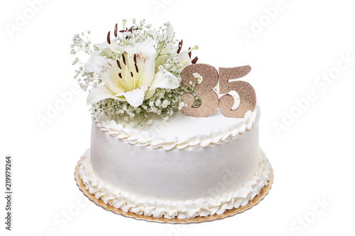 Fototapeta Naklejka Na Ścianę i Meble -  A birthday cake with a lily, for thirty-five years.