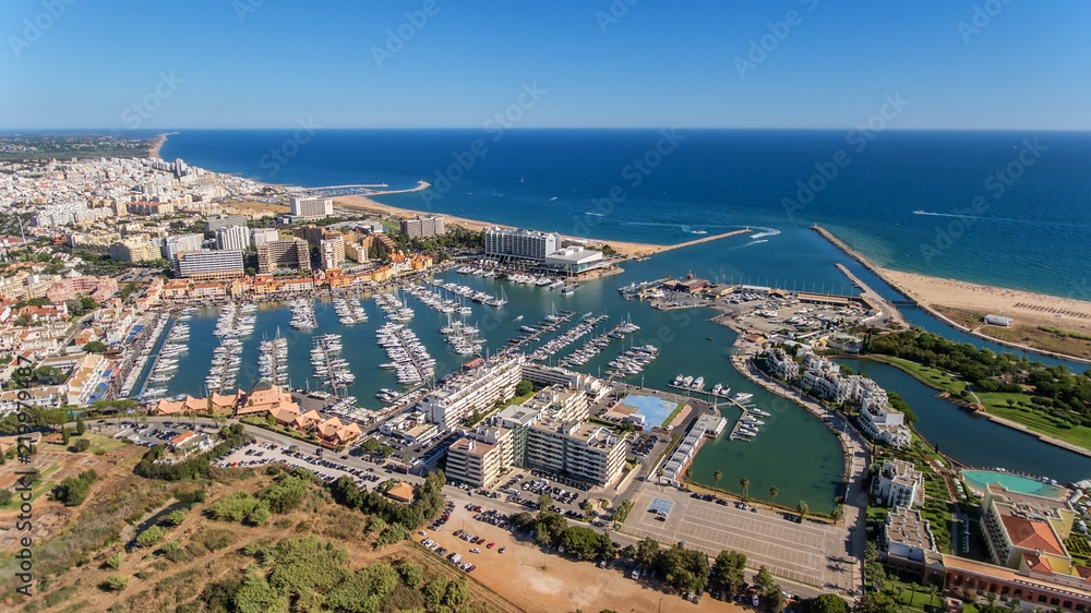 Fototapeta premium Aerial view of the bay of the marina, with luxury yachts in Vilamoura.