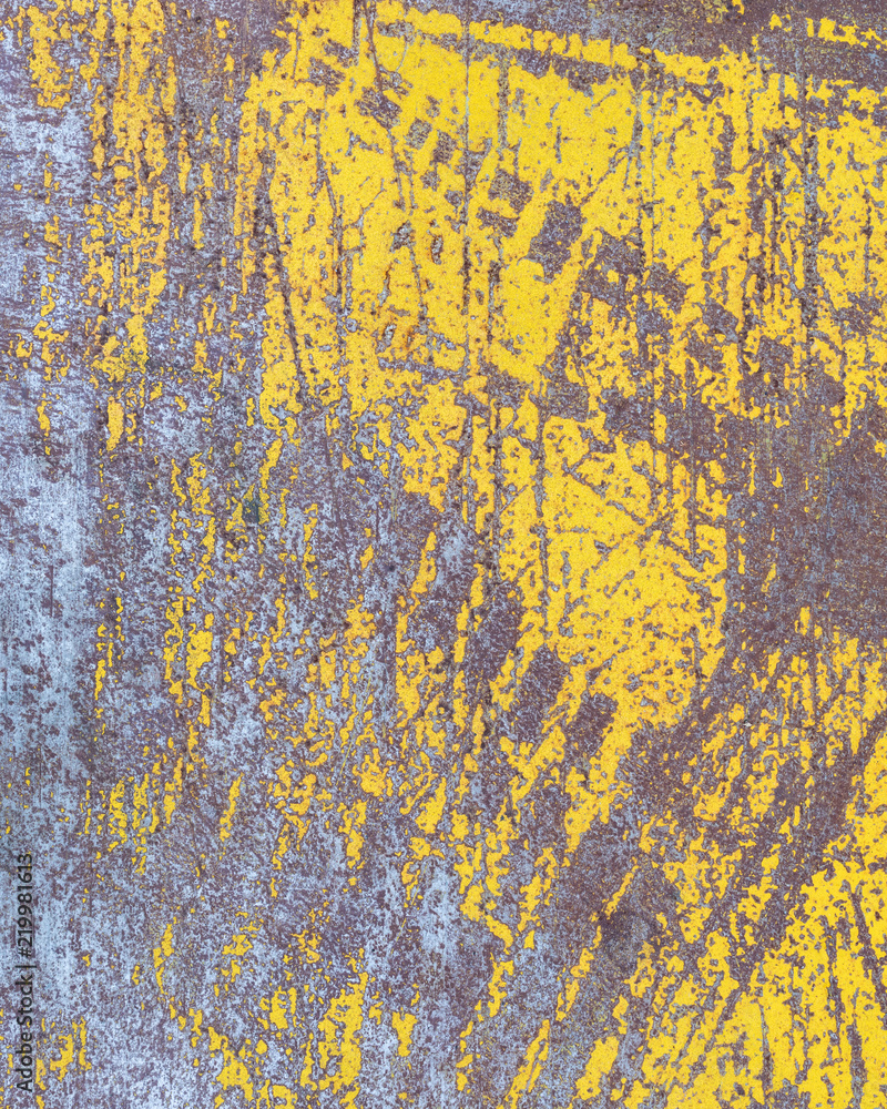 Worn yellow paint on metal sheet texture background