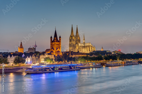 The famous skyline of Cologne with the river Rhine and the cathedral at dusk  © elxeneize