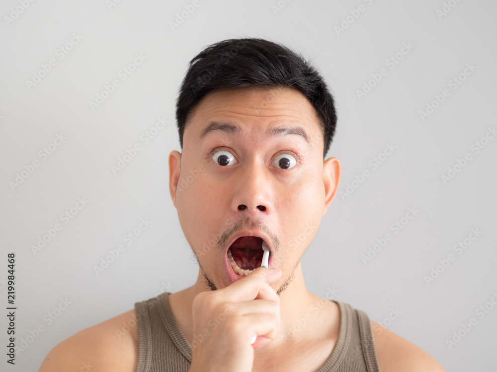 Funny face man brush his teeth without foam. Funny face man brush his teeth without foam.