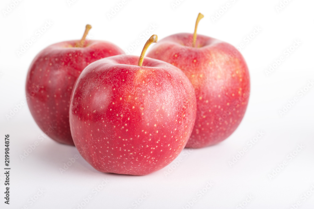 red ripe apples on a white background red ripe apples on a white background