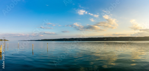 Germany  XXL panorama of reflecting clouds in water of lake constance at dawn