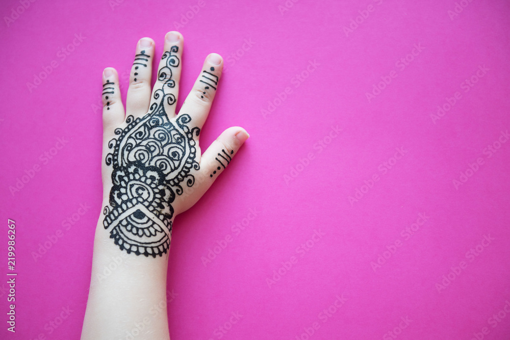 Chote Baccho Ki Xxx Videos - Children hand with black cute henna mehendi designs. Pink background. Stock  Photo | Adobe Stock