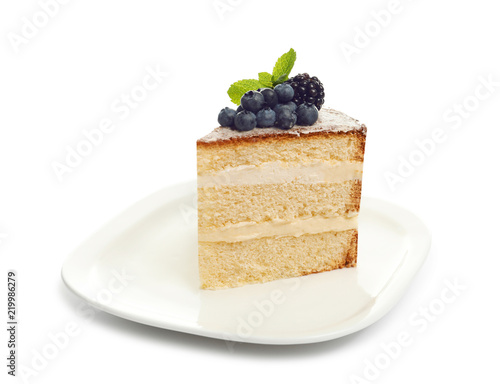 Piece of delicious homemade cake with fresh berries on white background