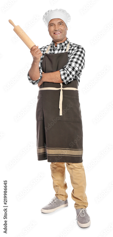 Mature male chef holding rolling pin on white background Mature male chef holding rolling pin on white background