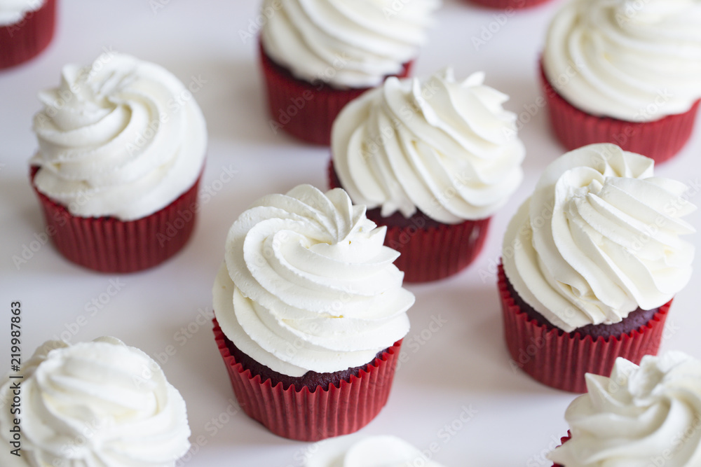 Red velvet cupcakes. cupcakes topped with swirl of sweet vanilla frosting