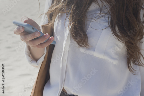 Girl with phone in her hand.
