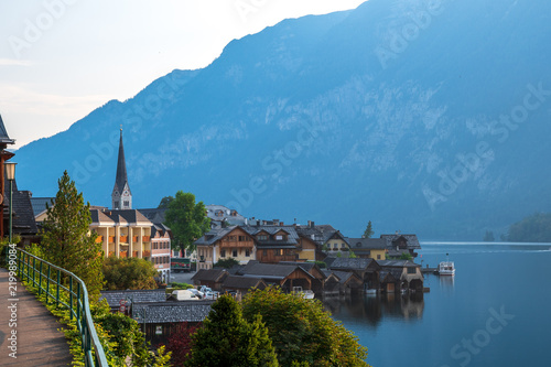 View of the Alpine town of Hallstatt on the shore of a mountain lake at dawn